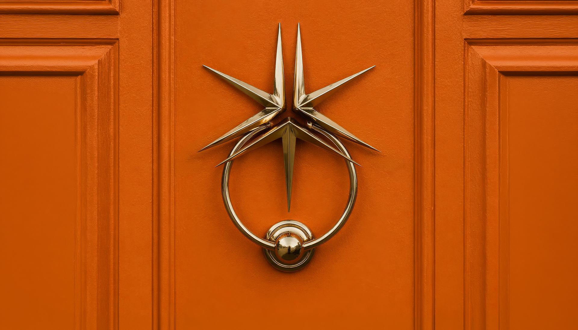 Door knocker with the Miller Thomson spark on an orange door