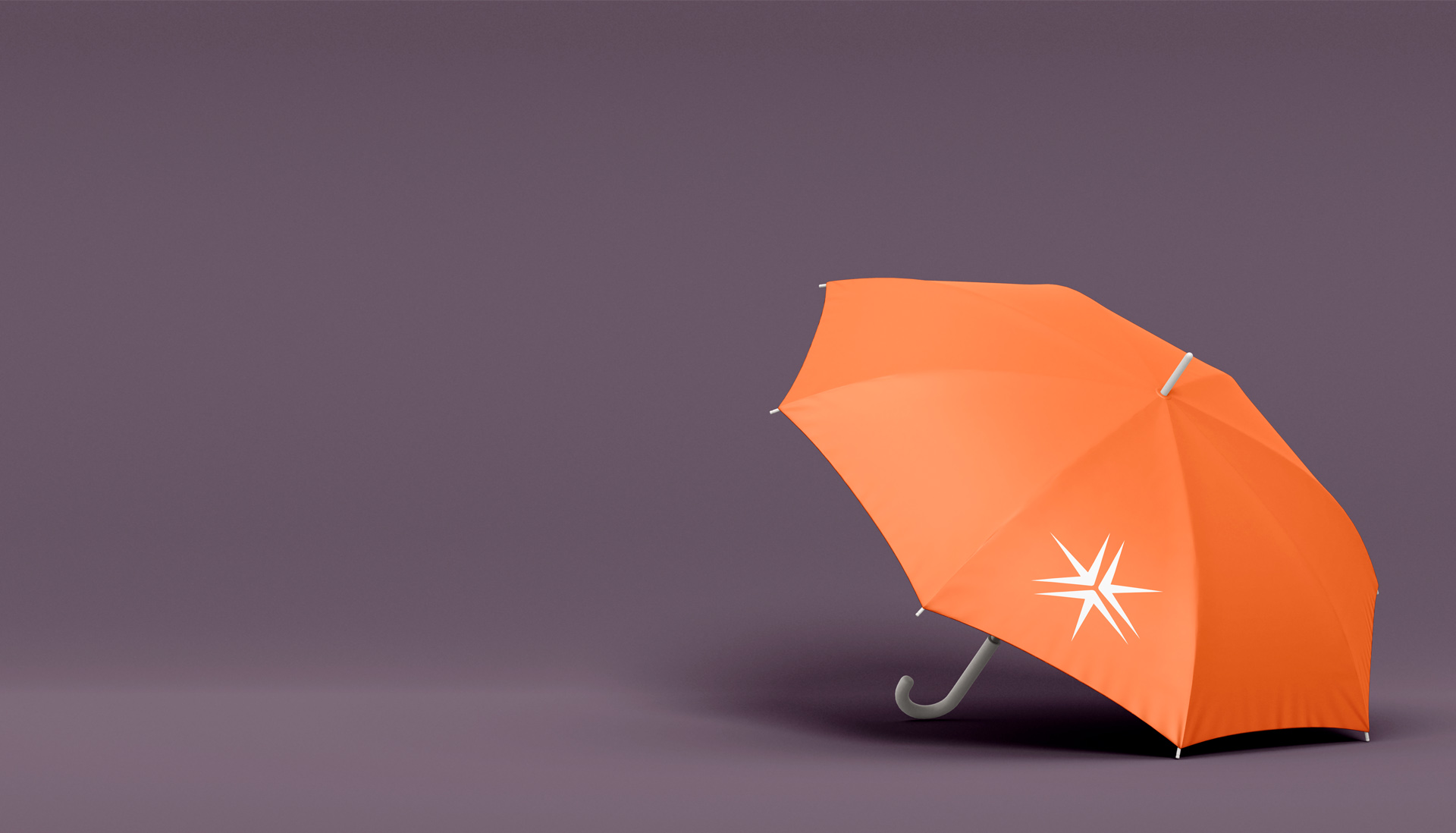 open executive umbrella sitting on a purple backdrop