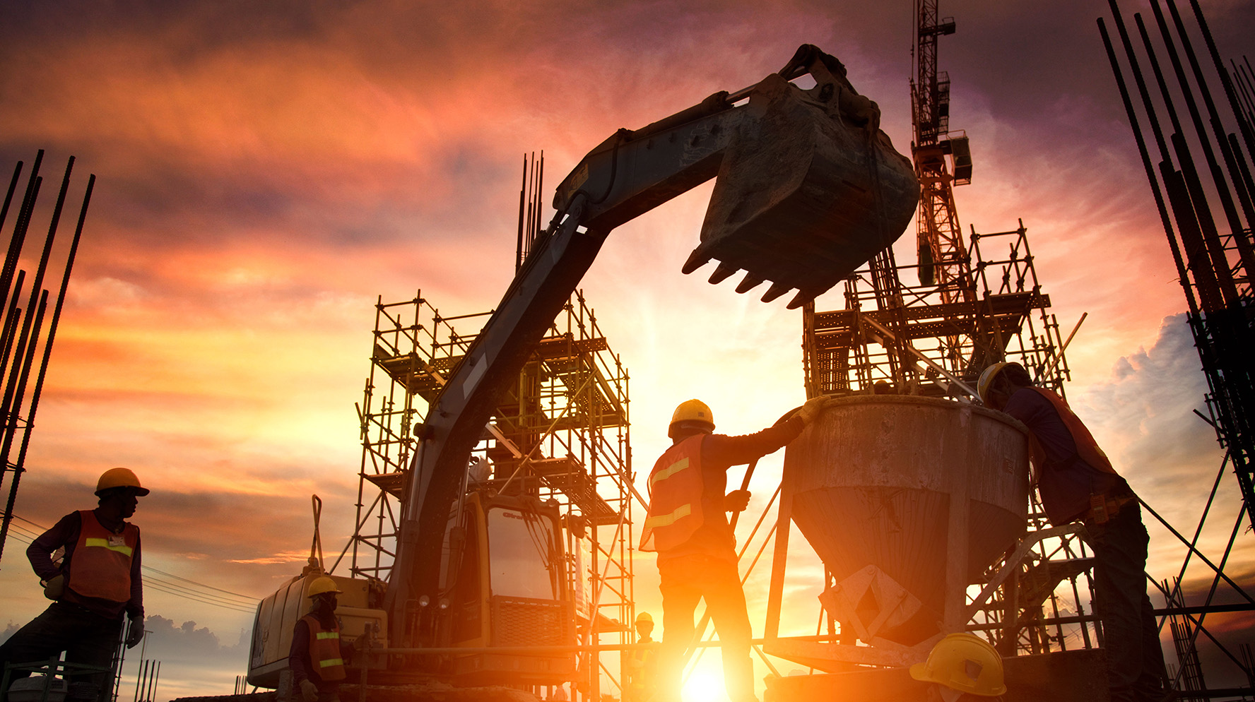 construction worker standing in front of bulldozer