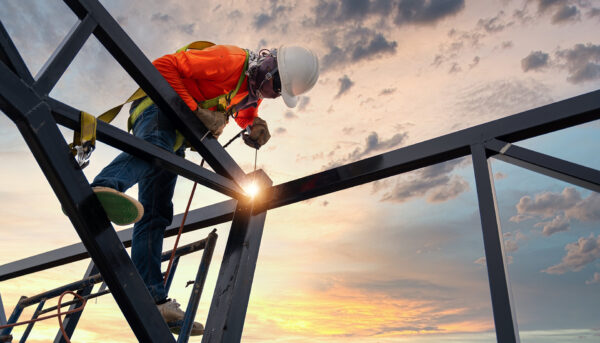 welder standing on steel beams