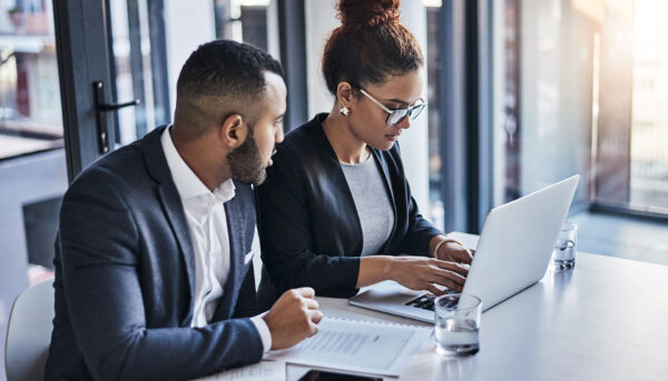Lawyers planning with laptop in office for trial preparation