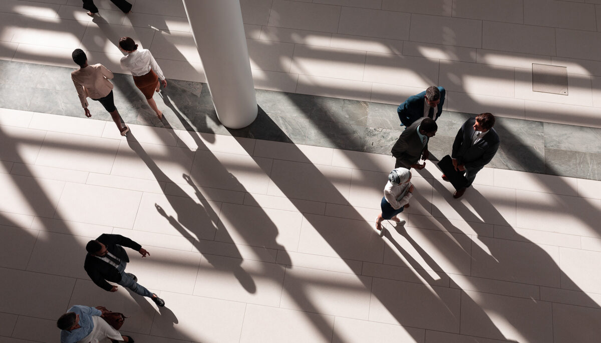 people walking in an office lobby viewed from above