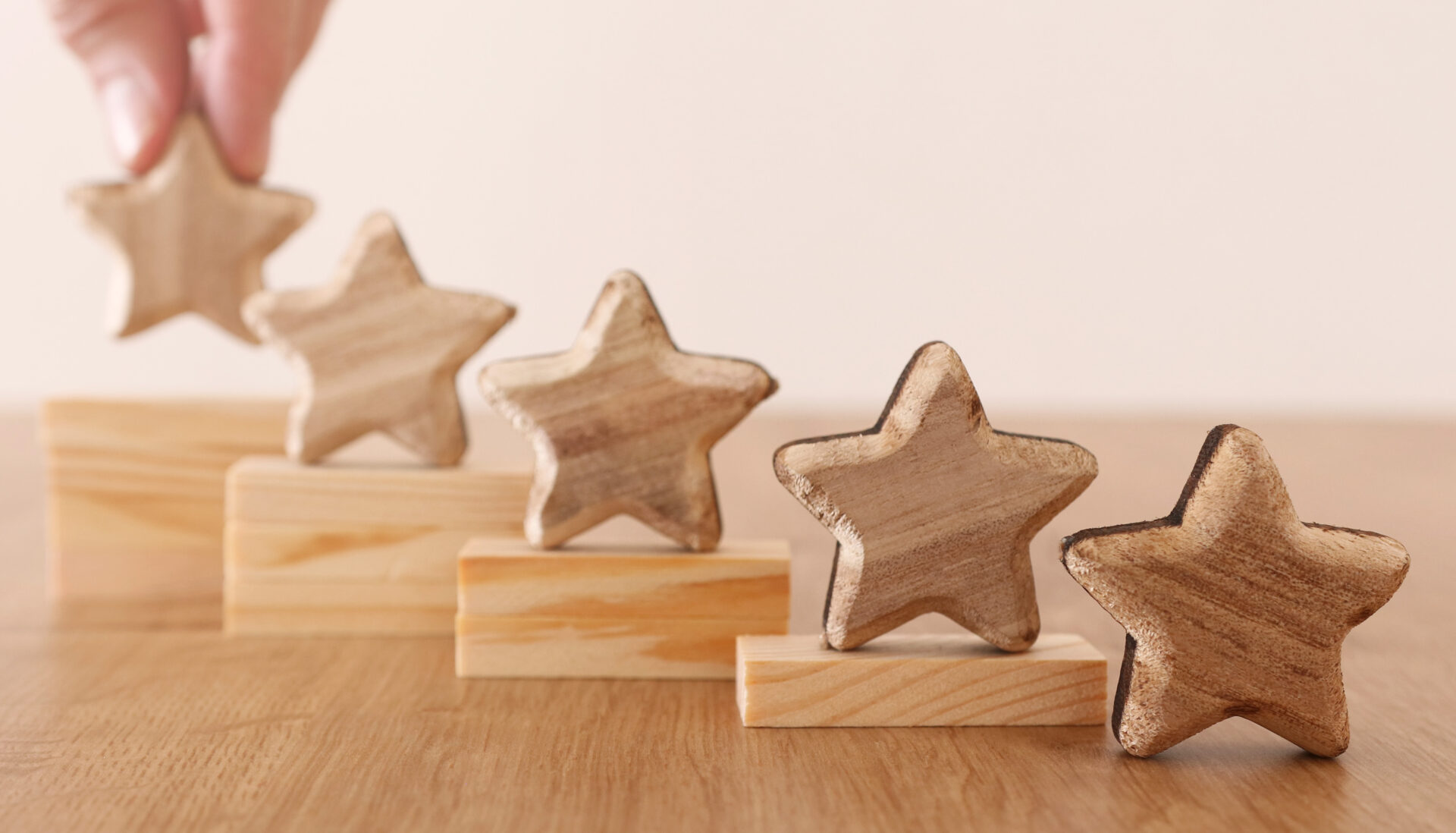 five wooden stars on a