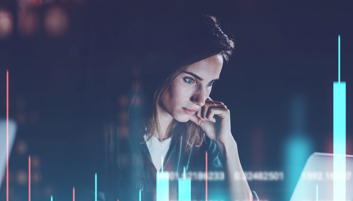 Young business woman looking at a computer monitor
